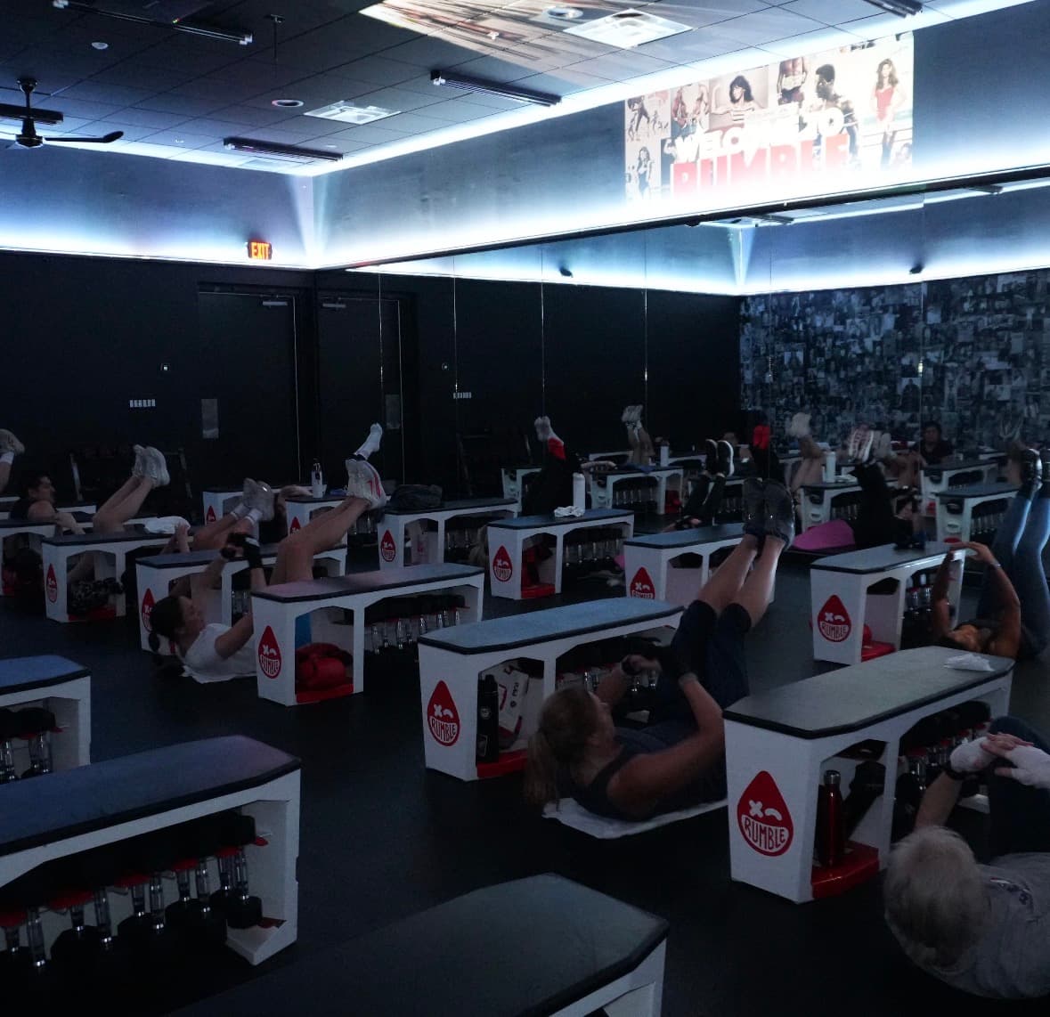 Floor-based strength training during a Rumble Boxing class in Alpharetta